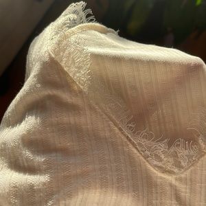 Off-white crop top from Dillard’s. Lace detail on v-neck line.